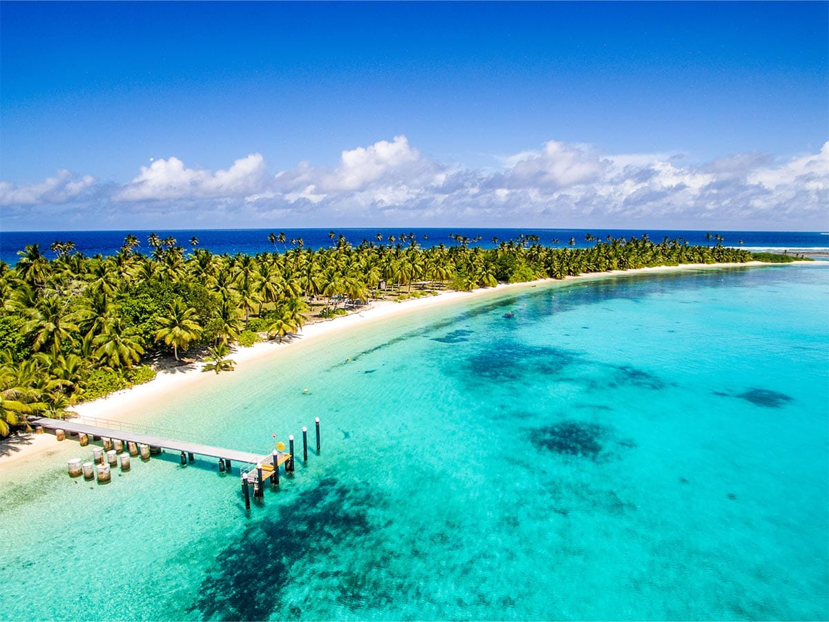 Crystal clear waters of the Cocos (Keeling) Islands with jetty