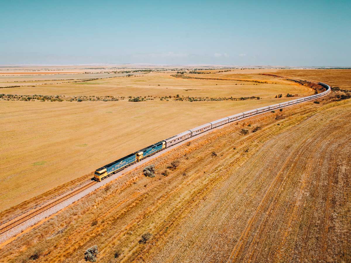 the Indian Pacific train traversing the vast and dry landscape of Clare Valley