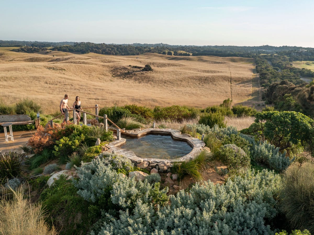 a couple heading towards a thermal pool at Peninsula Hot Springs