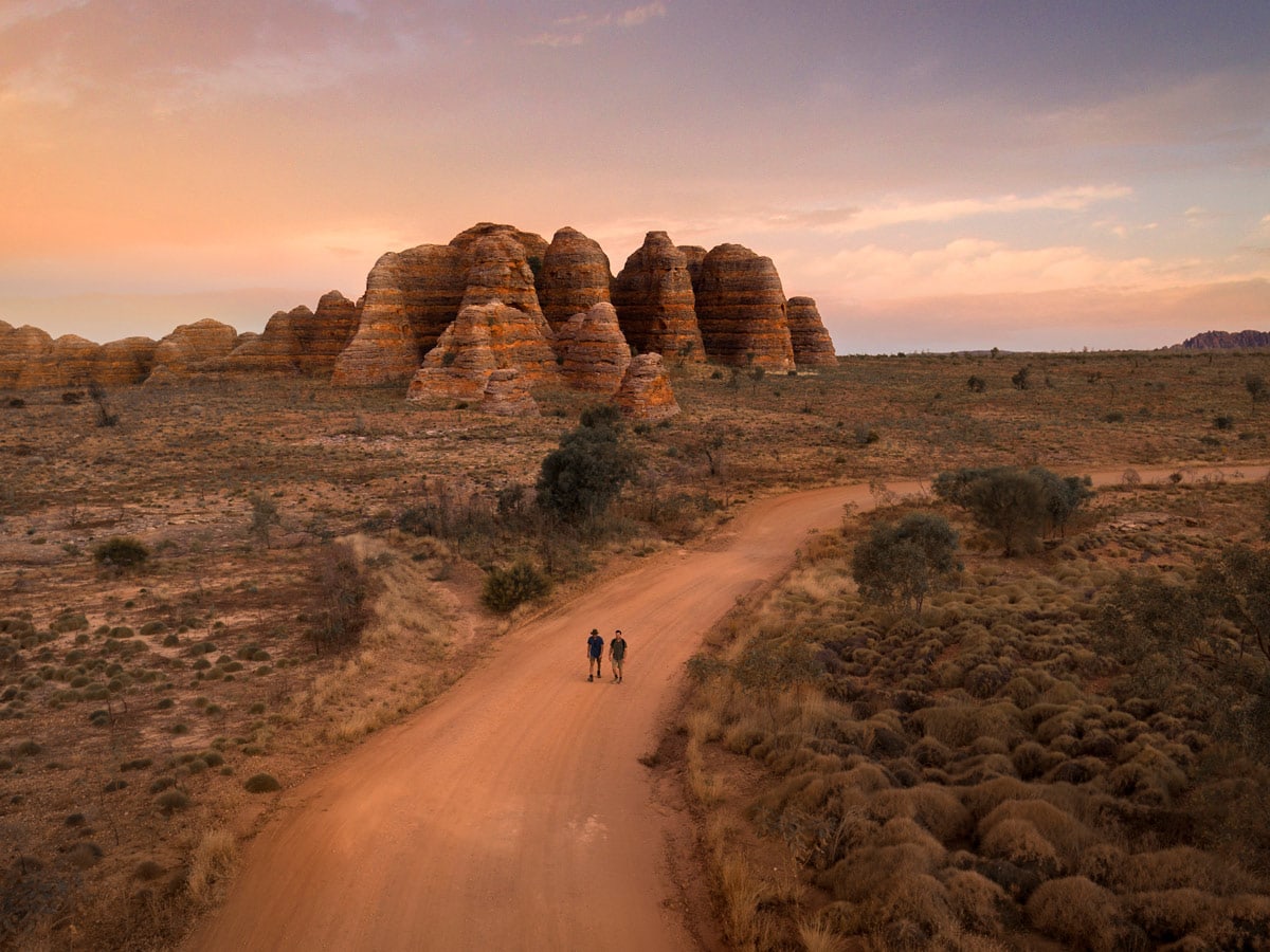 two people walking toward The Bungle Bungle Range, Purnululu National Park