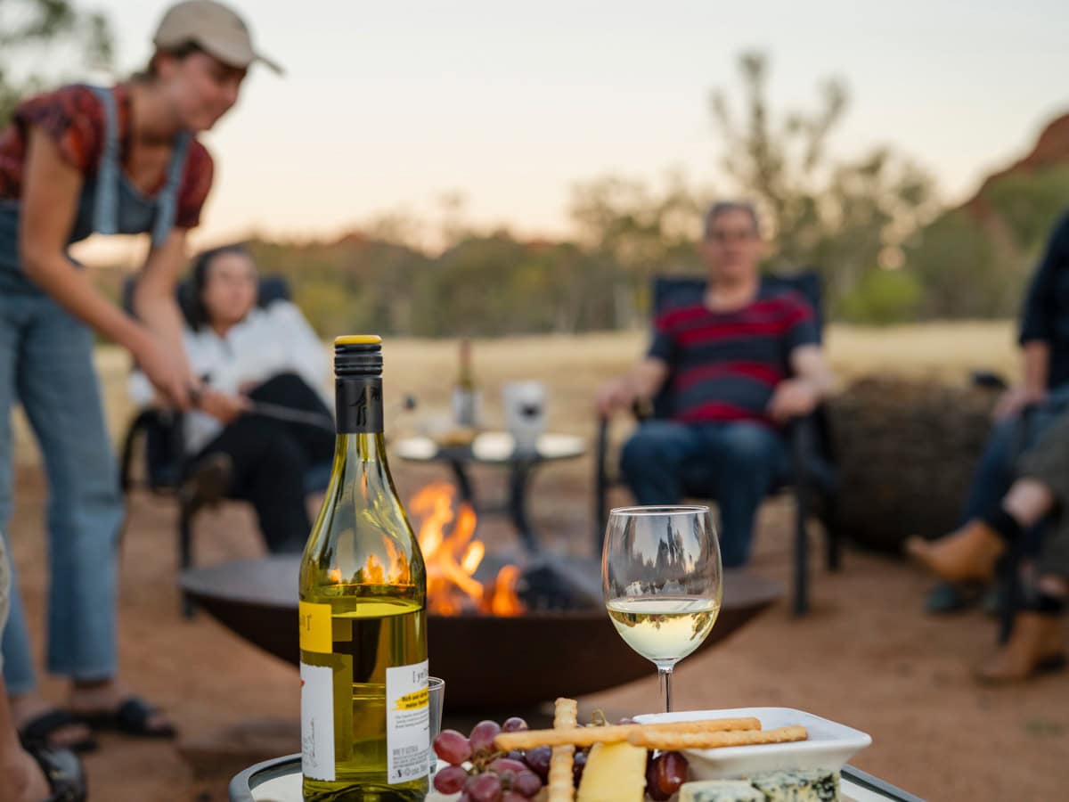 Family around the campfire at Squeaky Windmill near Alice Springs