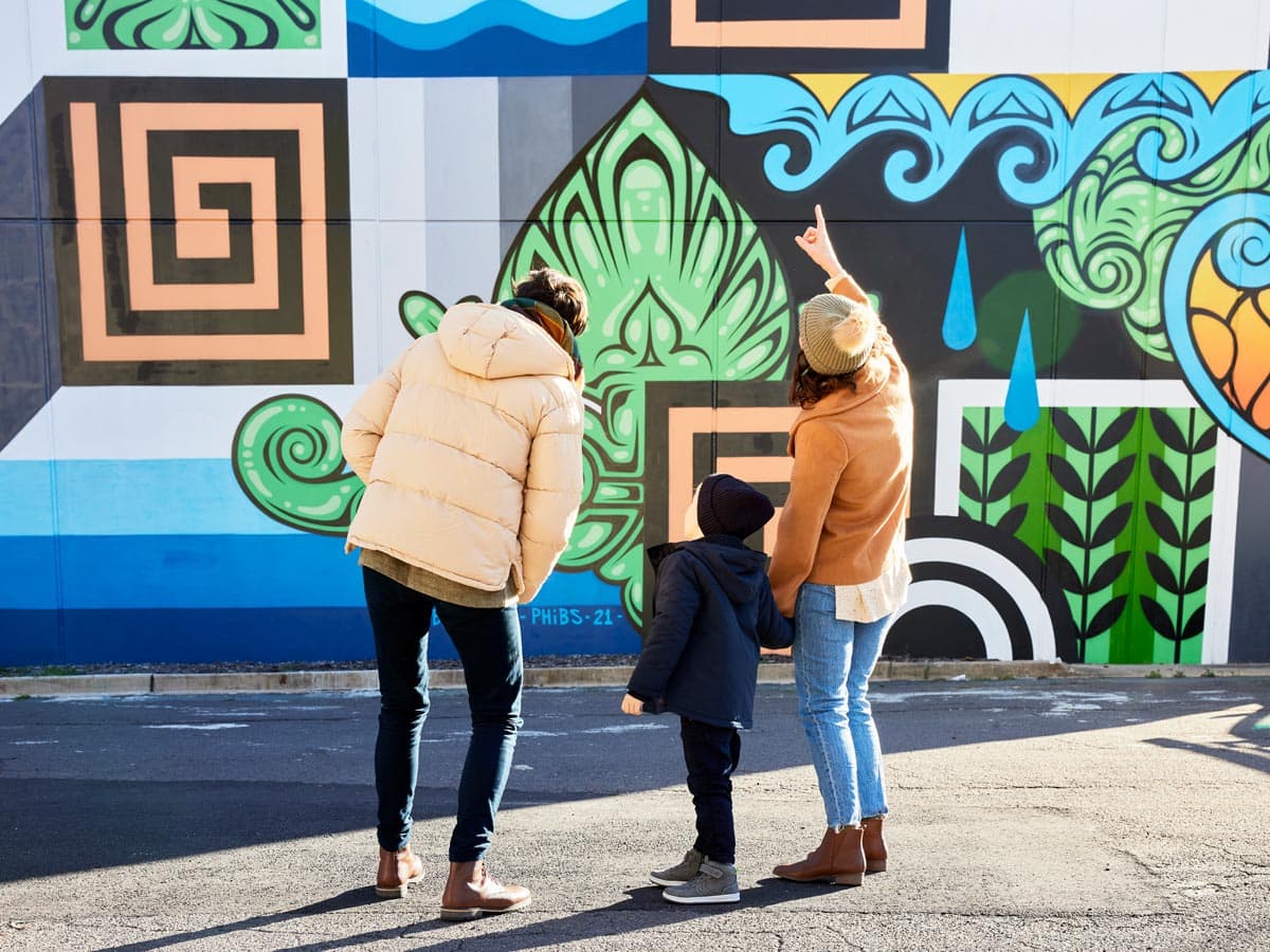 Family admire street art in Braddon Canberra