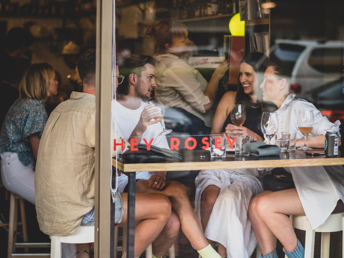 A group gathers for drinks at Hey Rosey in Orange