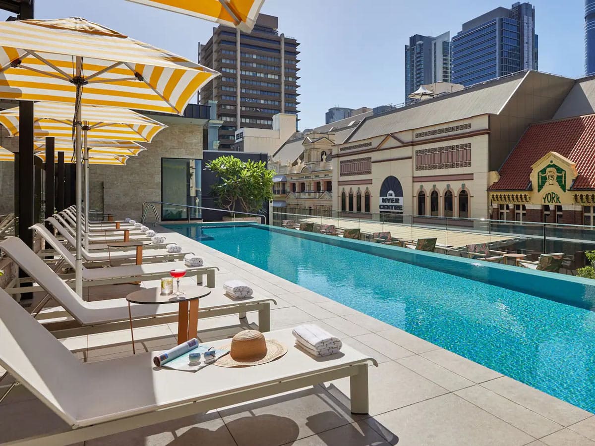 A swimming pool surrounded by the city.