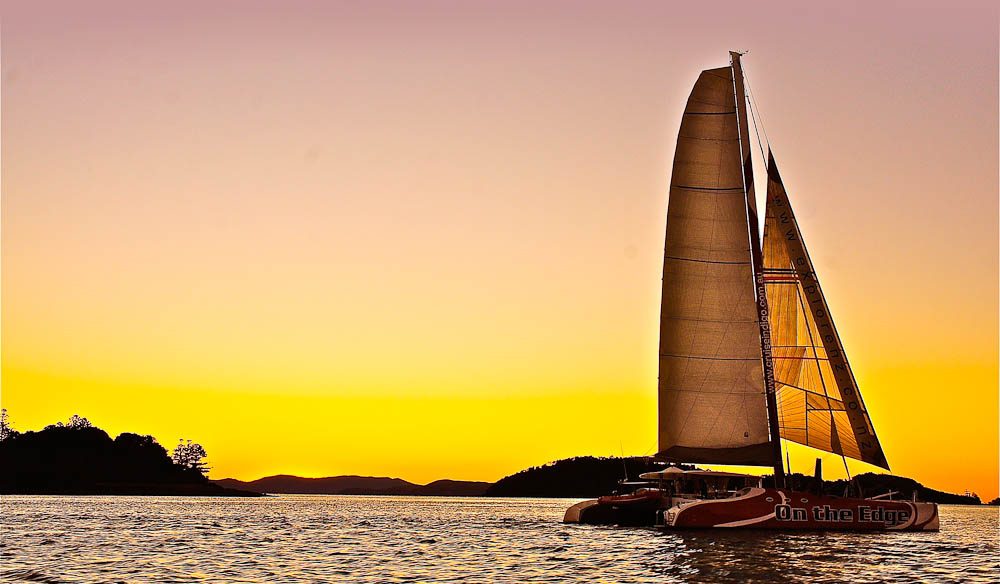 Sailing into the Whitsundays sunset, drink and canape in hand, of course.